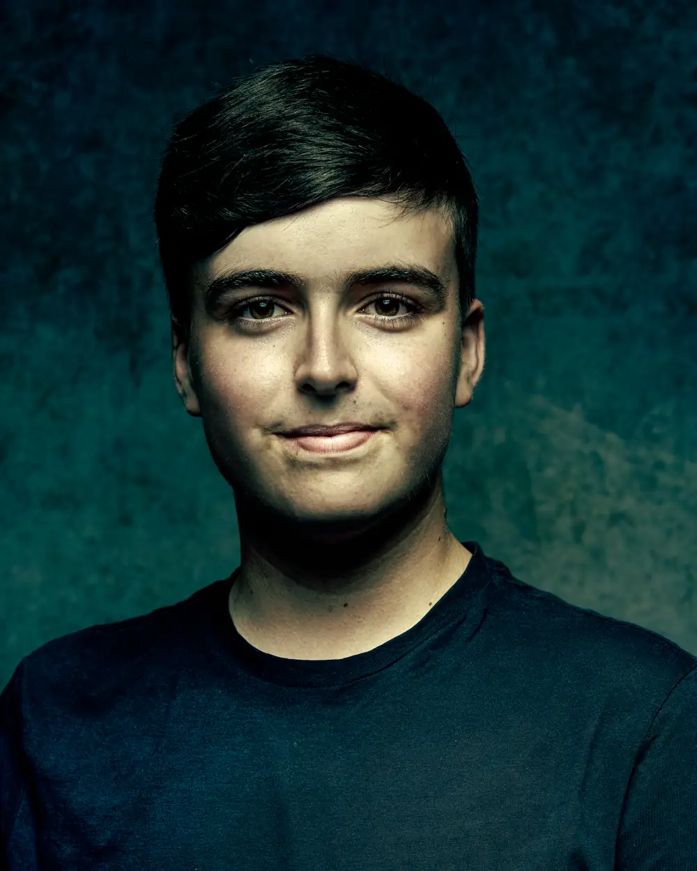 Actor headshot with a neutral studio backdrop