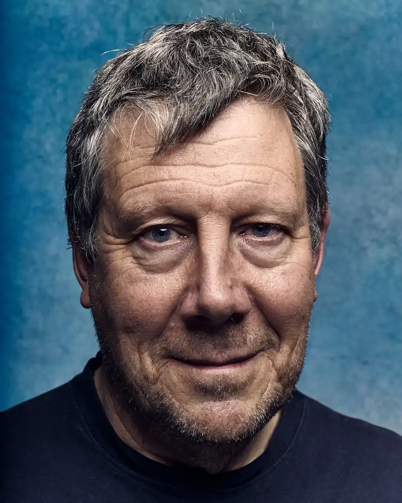 Actor headshot against a plain studio background