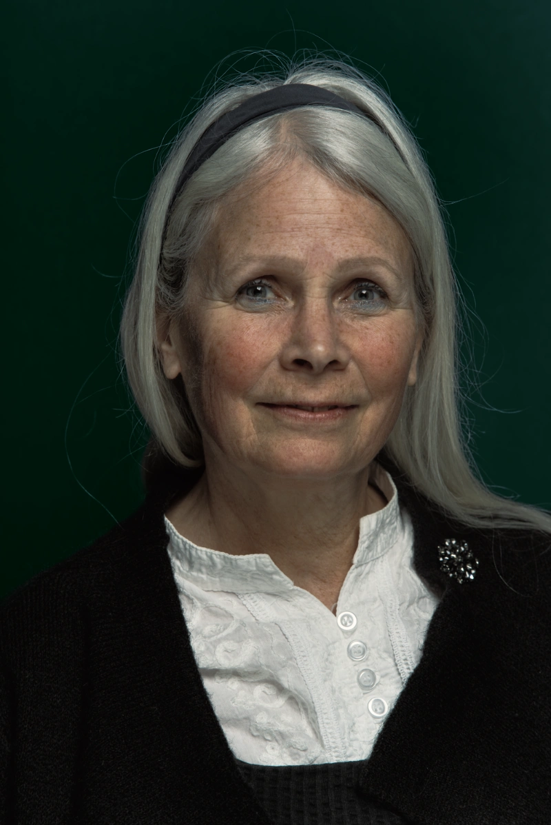 Actor headshot with a neutral studio backdrop