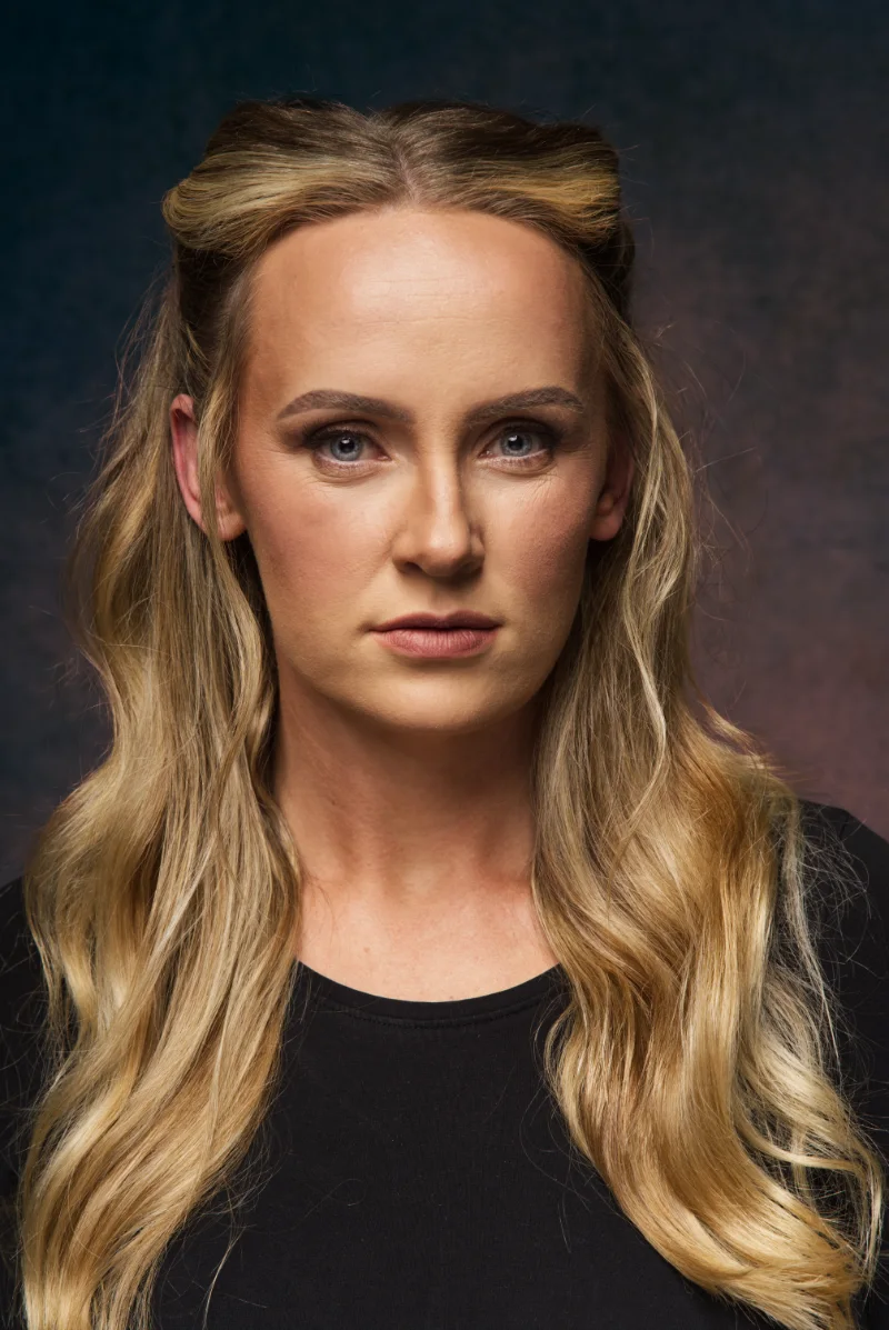Actor headshot against a plain studio background
